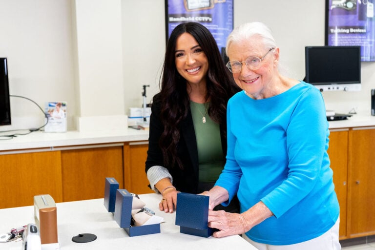 image of two women smiling in East Texas Lighthouse low vision aids store