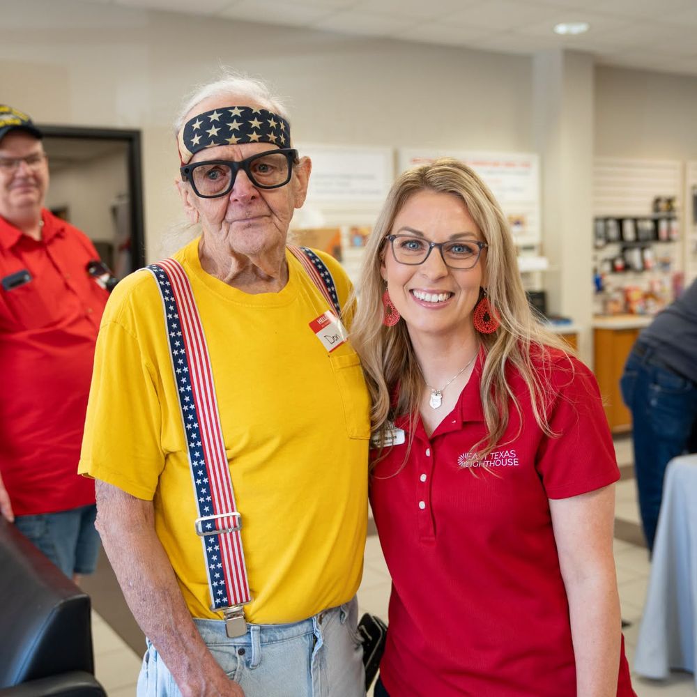 A pair of Ray-Ban Meta Wayfarer glasses resting on a stack of boxed pairs ready for distribution.