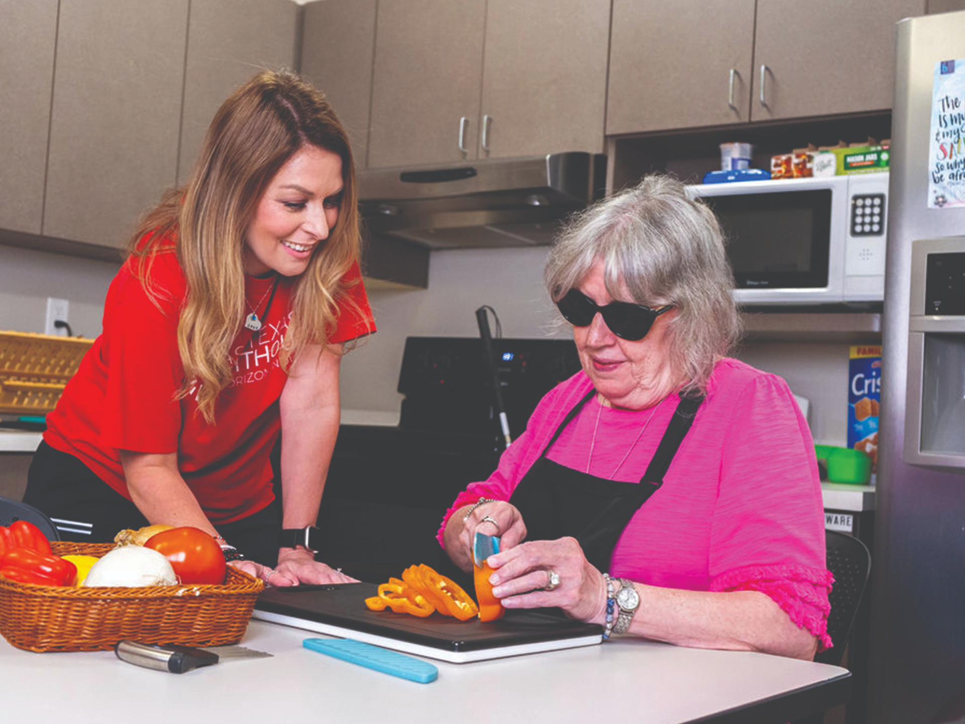 An instructor and a client working together in the East Texas Lighthouse teaching kitchen.